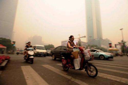 Residents rushed to put on face masks when they saw the haze in Wuhan on Monday