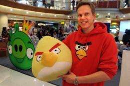 Rovio Asia senior vice president Henri Holm with an "Angry Birds" doll at an official Facebook launch in Jakarta