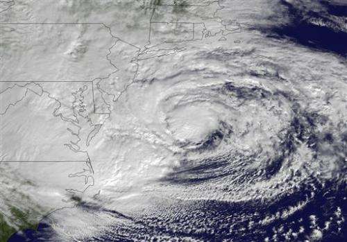 Sandy: Losing tropical nature, but gaining girth