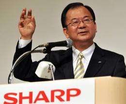 Sharp's newly appointed president Takashi Okuda announces the company's tie-up with Taiwan's Hon Hai Precision