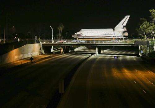 Shuttle inches toward retirement home at LA museum