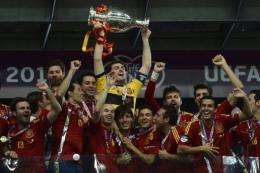 Spanish players celebrate with the trophy after winning the Euro 2012 championships at the Olympic Stadium in Kiev