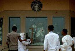 Sudanese protesters try to break into the US embassy in Khartoum during a protest against an amateur film mocking Islam