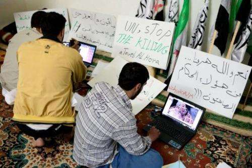 Syrian activists use the internet in a town west of Aleppo