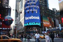 The Nasdaq board in Times Square advertises Facebook