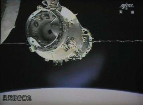 The spacecraft approaches the module for docking