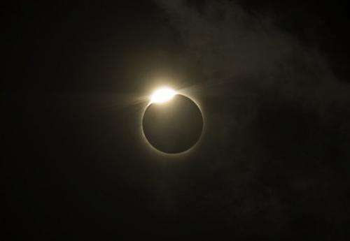 The sun is covered by the moon during a total solar eclipse in the Indian city of Varanasi in 2009