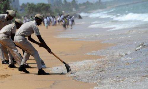 Thin layers of furnace oil washed ashore in several places on Saturday in and around Colombo