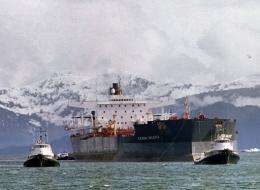 Tugboats tow the Exxon Valdez off Bligh Reef in Prince William Sound on April 5, 1989, two weeks after it ran aground