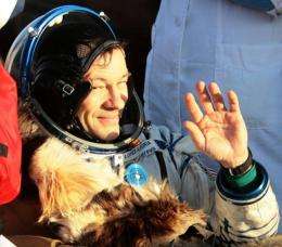 US astronaut Michael Lopez-Alegria waves shortly after the landing of Russian Souyz TMA-9 space capsule in 2007