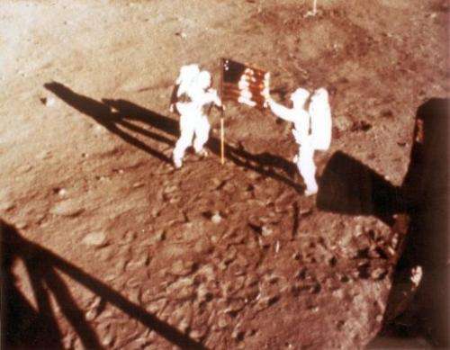 US astronauts Neil Armstrong and "Buzz" Aldrin deploy the US flag on the moon in 1969