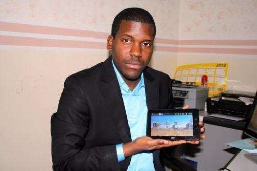 Verone Mankou displays the tablet he invented in the offices of his company, VMK, in Brazzaville on January 31, 2012