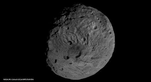 Vesta likely cold and dark enough for ice