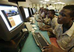 Young Ivorians learn how to use a computer