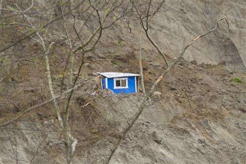 A day after Wash. landslide, examinations continue