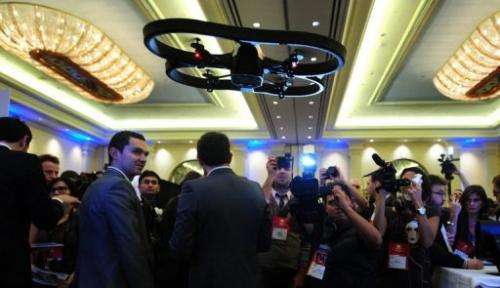 An A.R. Drone helicopter by Parrot flies overhead during an electronics show on January 6, 2010 in Las Vegas, Nevada
