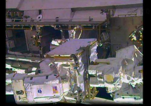 A NASA TV still image shows the International Space Station during an spacewalk by NASA astronauts Rick Mastracchio and Mike Hop