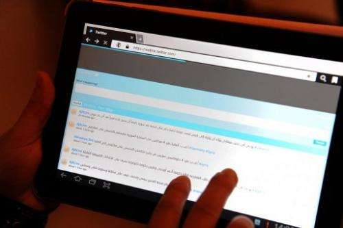 A Saudi woman uses a tablet computer at a coffee shop in Riyadh on February 9, 2012