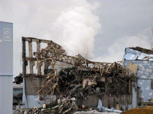 A Tepco picture from March 15, 2011 shows smoke rising from unit 3 reactor building at the Fukushima nuclear plant