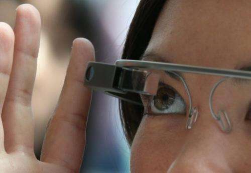 A woman tries on Google Glass during the Google I/O developer conference in San Francisco on May 17, 2013