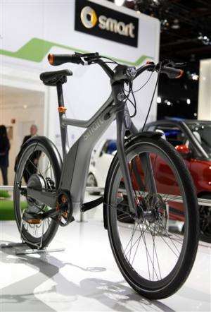 Bikes share space with cars at Detroit auto show
