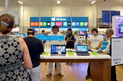 Customers check out Windows 8 from Microsoft a new Windows Store at Best Buy on August 7, 2013 in Los Angeles