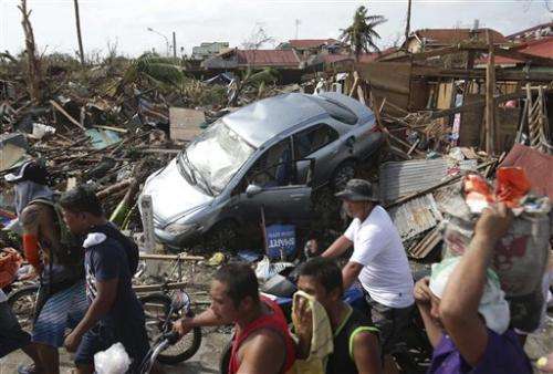 Experts: Man, nature share typhoon tragedy blame