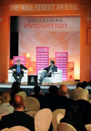 Facebook co-founder Eduardo Saverin (on stage, L) speaks during an interview in Singapore, on February 21, 2013