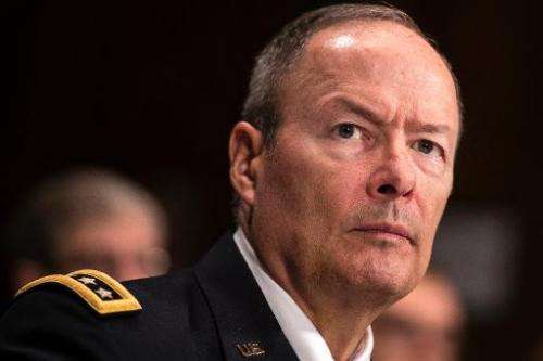 General Keith Alexander, Director of the National Security Agency, listens during a hearing of the Senate Judiciary on Capitol H