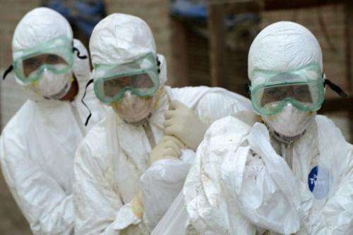 Health workers carry sacks of dead chickens at a farm with a suspected bird flu outbreak near Kathmandu, August 1, 2013