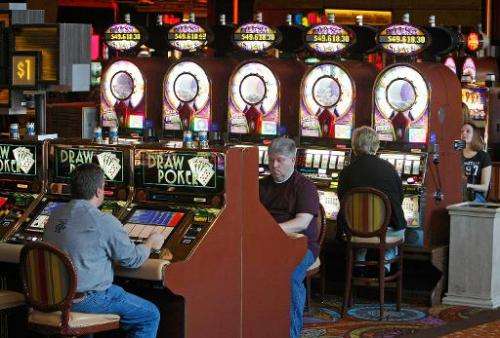 In this file photo, people play slot machines at the Mirage Hotel &amp; Casino in Las Vegas, Nevada, on November 24, 2008