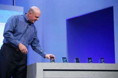 Microsoft CEO Steve Ballmer looks at a display of Windows phones on June 26, 2013 in San Francisco