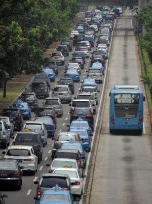 Motorists are trapped in the rush-hour gridlock in Jakarta, on October 22, 2013