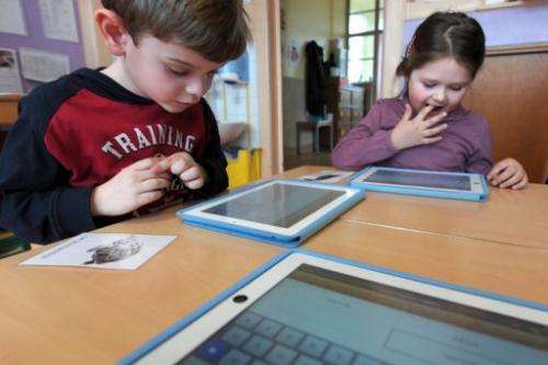 Nursery school pupils work with tablet computers on March 18, 2013 in Haguenau, northeastern France
