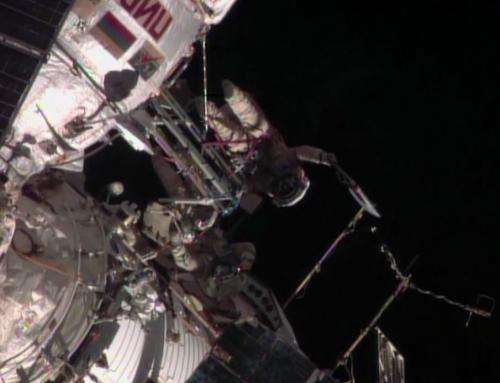 Russians take Olympic torch on first-ever spacewalk