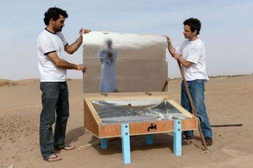 Scientists show a nomad how to assemble a &quot;waterpod&quot; near the village of M'Hamid El Ghizlane in Zagora on March 16, 20