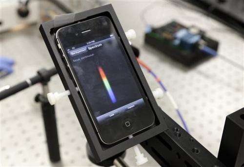 Smartphone cradle, app detect toxins, bacteria