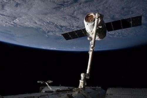 The SpaceX capsule Dragon attached to the Canada Arm at the the International Space Staion (ISS) on March 3, 2013