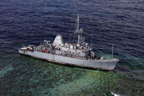 The USS Guardian sits aground on January 22, 2013 on the Tubbataha Reef