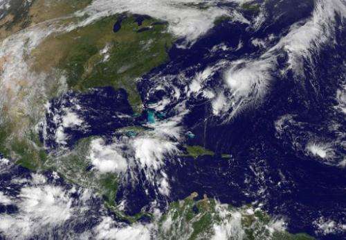 This NASA satellite image, released September 2013, shows Tropical Storm Gabrielle (Upper R) closing in on Bermuda