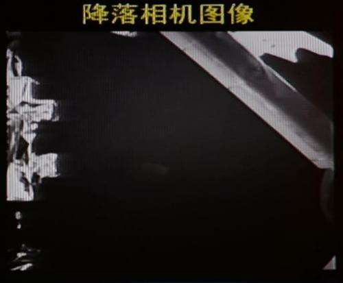 This screen grab taken from CCTV live broadcasting footage shows an image of China's first lunar rover transmitted back to the c