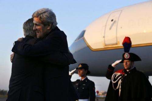 US Secretary of State John Kerry embraces US Ambassador to Italy David Thorne as he arrives in Rome, February 27, 2013