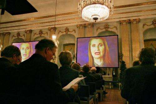 A picture taken on December 7, 2004 shows Nobel Prize winner Austrian Elfriede Jelinek (on screen) during a videotaped prize lec