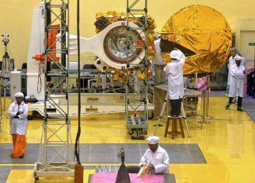 File pictures show scientists and engineers working on a Mars Orbiter vehicle at the Indian Space Research Organisation's (ISRO)