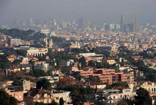 A general view shows the Catalan city of Barcelona shrouded by haze on December 9, 2013