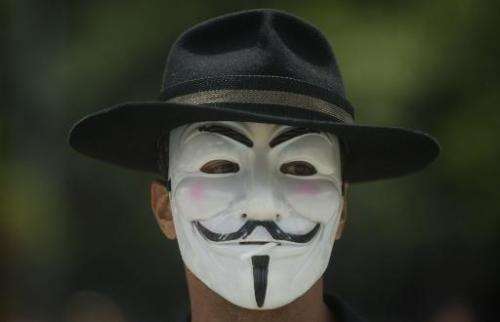 Illustration: hackers from Anonymous, who often wear Guy Fawkes masks similar to the one pictured when making public statements,