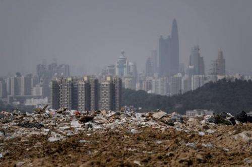 A landfill in Hong Kong on March 6, 2013, as the Chinese city of Shenzhen looms in the background