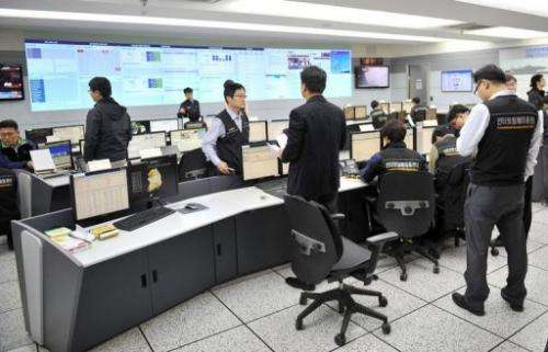 Members of the Korea Internet Security Agency investigate cyber attacks in Seoul on March 20, 2013