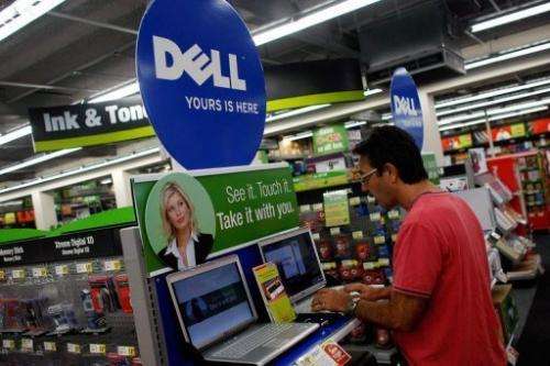 A man looks at a Dell computer on sale at a Staples store in Miami on November 11, 2007