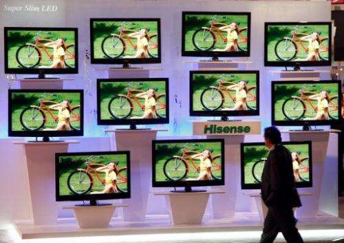 A man walks past LED televisions at the 2009 International Consumer Electronics Show in Las Vegas on  January 10, 2009